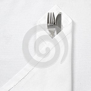 Knife and fork with linen serviette