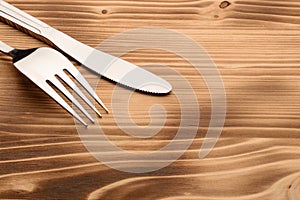 Knife and fork set on a wooden vintage table