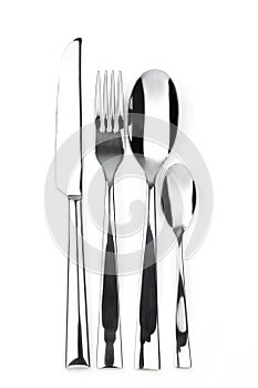 Knife, fork, spoon and teaspoon