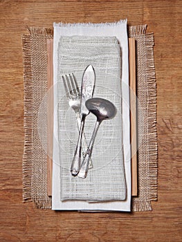 Knife and fork on vintage clothes