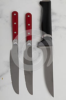 Knife isolated on white background with red handle