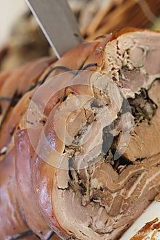 Knife on Roast Pork photo