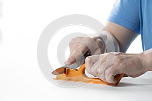 A knife sharpener. A man sharpens a knife on a special universal knife sharpener photo