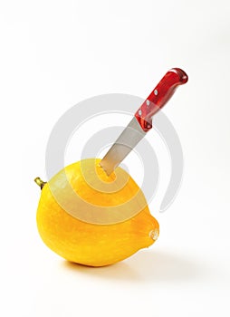 Knife stabbed in pumpkin