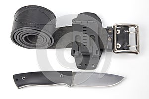 Knife for tourism and hunting with a plastic case on a black leather belt on a white background