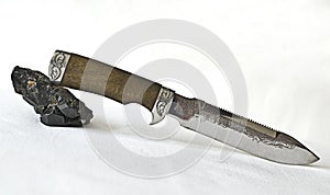 Knife and Tourmaline cristall photo