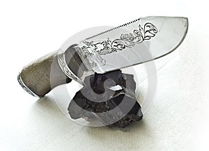 Knife and Tourmaline cristall photo