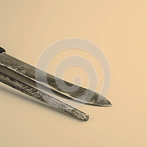 Knife and whetstone isolated on white background