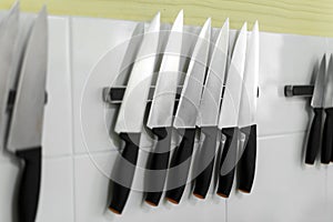 Knifes set on kitchen wall