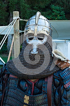 Knight armor on display with shield and weapons