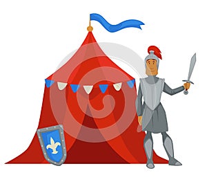 Knight in armor with sword near military camp tent