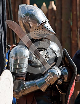 Knight in armour with shield and sword