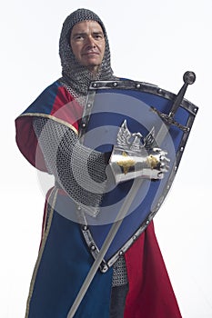 Knight in full armor with shield and sword, vertical