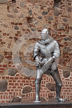 Knight in full armor with a sword