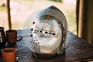 Knight Helmet Of Medieval Suit Of Armour On Table