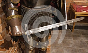 The knight in his hand holds a sword and shield. Protecting warriors during battle in ancient times, close-up