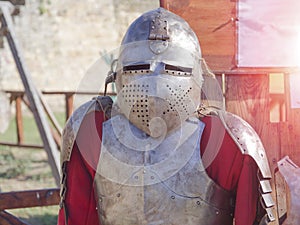 Knight`s armor in the sun in the summer outdoors