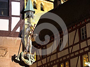 Knight statue at a house corner at the medieval square