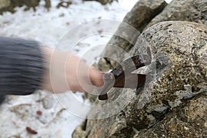 Knight tries to remove Excalibur sword in the stone