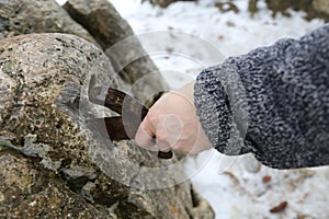 knight tries to remove Excalibur sword in the stone