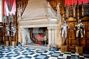 Knights armor and a large fireplace inside of Great Hall in Edinburgh Castle