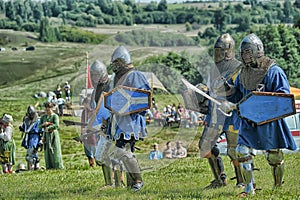 Knights in armor with shields