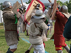 Knights in Battle with Silver Helmets and Armors