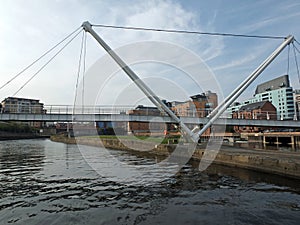 Knights bridge crossing the river aire in leeds with surrounding riverside apartments