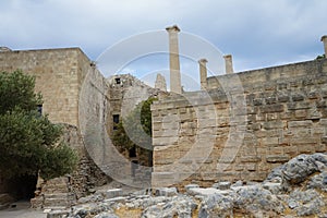 Knights Headquarters on the Acropolis of Lindos on the left side and the part of the Hellenistic wall of Stoa on the right side.