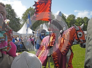 Knights on horses with banners and dress at a show in Ireland stallion donkey pony Clydesdale dual Gard 1