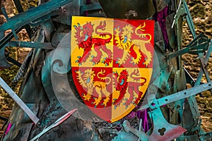 Knights shield and various weapons at castle grounds