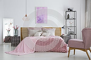 Knit blanket in feminine bedroom