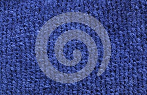 Knitted blue linen, background. Needlework, hobbies, knitting.