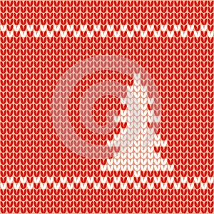 Knitted Christmas tree white on red background.