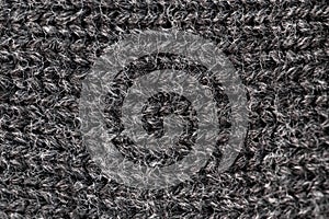 Knitted fabric made of grey merino wool, textured