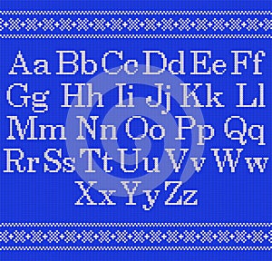 Knitted font on blue background. Christmas knit alphabet on seamless pattern. Nordic Fair Isle knitting border. Sweater Christmas