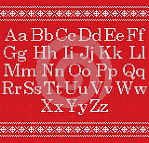 Knitted font on red background. Christmas knit alphabet on seamless pattern. Nordic Fair Isle knitting border. Sweater Christmas