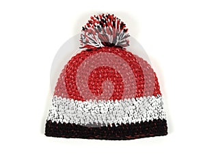 Knitted hat with pompom