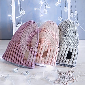 Knitted hats, close-up on a white background