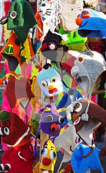 Knitted hats on market stall