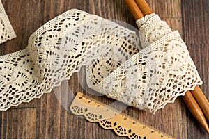 Knitted openwork linen ribbon tapes in rural style of rustics cotton eco natural on wood ground