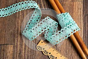 Knitted openwork linen ribbon tapes in rural style of rustics cotton eco natural on wood ground