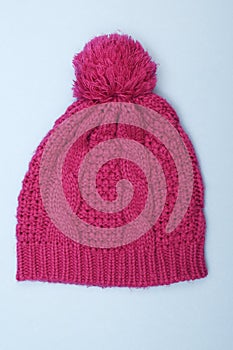 Knitted red hat with pompom