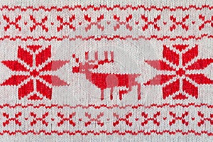 Knitted red and white ornament with deer