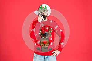 Knitted sweater. Happy new year. Christmas spirit. Funny outfit. Sweater with deer. Clothes shop. Buy festive clothing