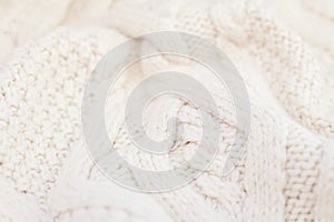 Knitted white fabric texture with a relief pattern