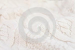 Knitted white fabric texture with a relief pattern