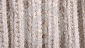 Knitted winter sweater fibers. Close-up. Macro video slider