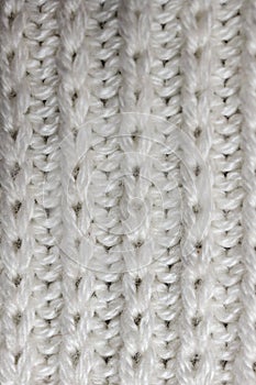 Knitted wool fabric. Background. Manufactory