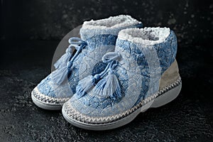 Knitted wool slippers, boots with warm plush insoles and pompons photo